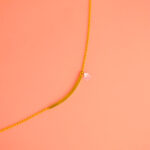 Tobillera Dorada de Acero de Titanio - Stiklo fondo rosa